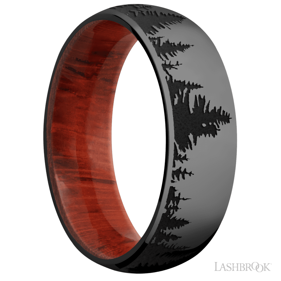 7 mm wide/Domed/Zirconium band with a laser carved Trees pattern also featuring a Padauk sleeve.