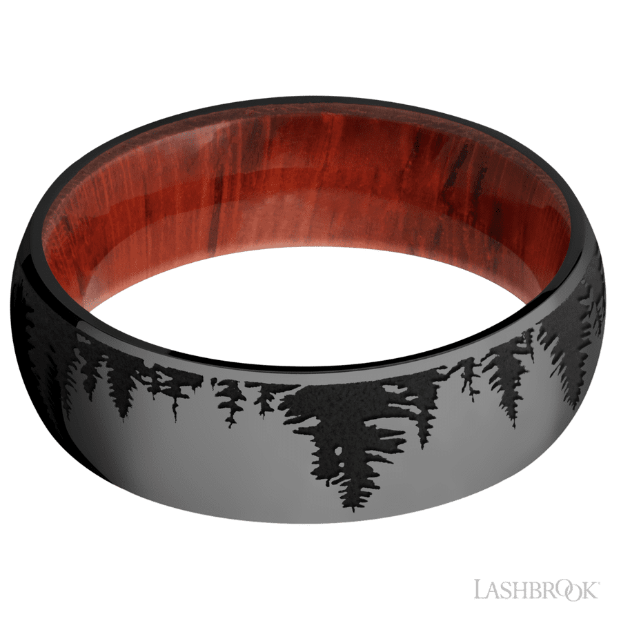 7 mm wide/Domed/Zirconium band with a laser carved Trees pattern also featuring a Padauk sleeve.