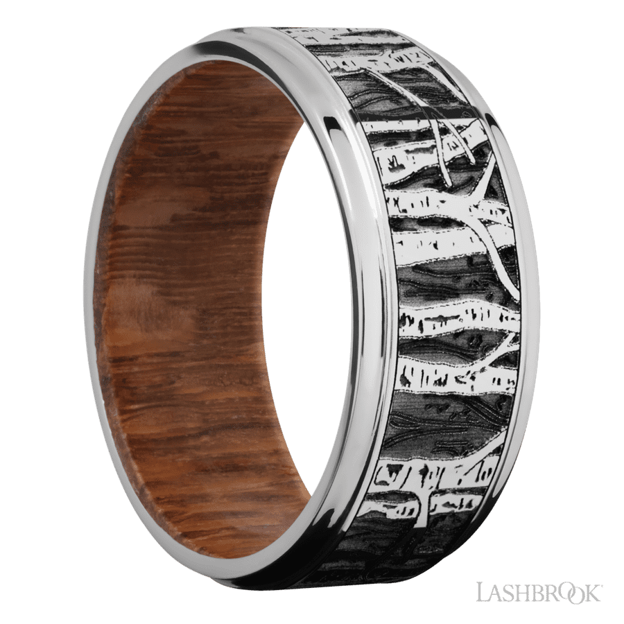9 mm wide/Flat Grooved Edges/Cobalt Chrome band with a laser carved Aspen pattern also featuring a Leopard Wood sleeve.