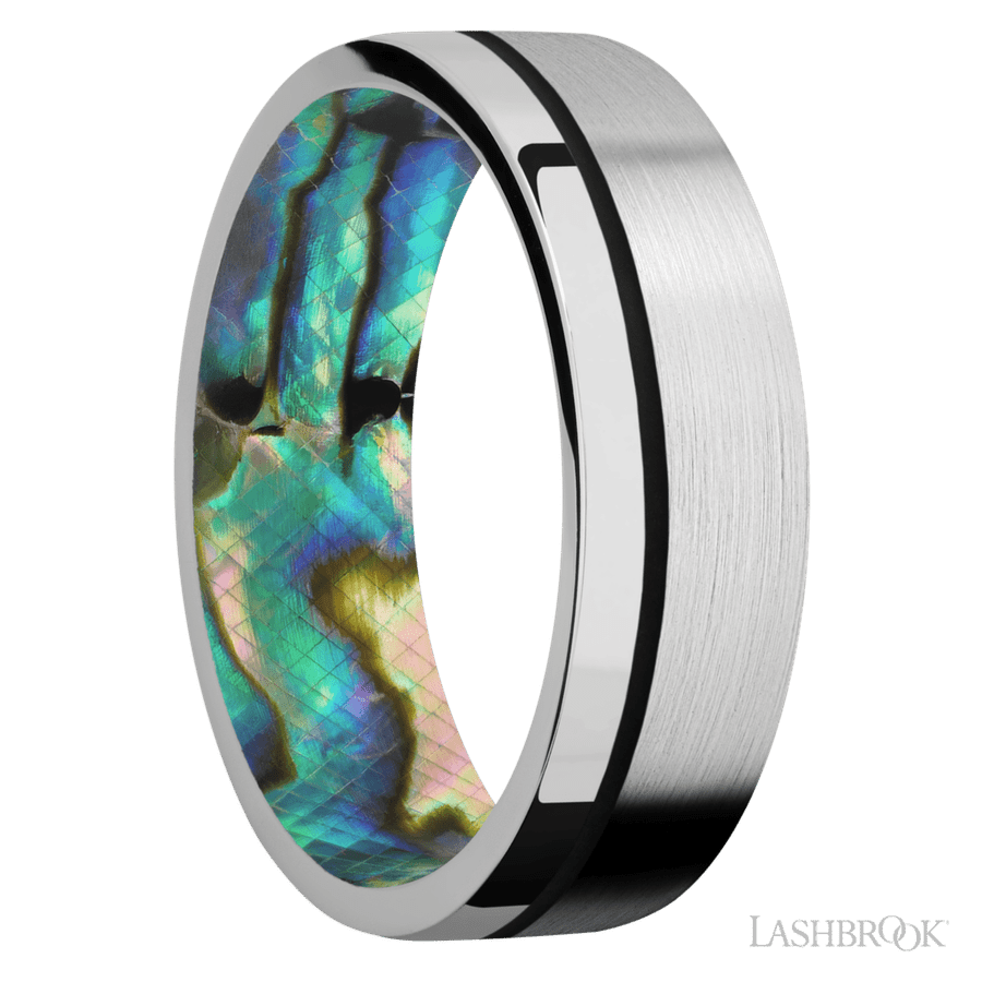 7 mm wide/Flat/14K White Gold band with one 0.5 mm Off Center inlay of Black also featuring a Abalone sleeve.