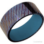 9 mm wide Flat Titanium Damascus band featuring a Royal Blue sleeve.