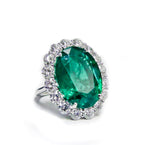 Oval Cut Emerald Halo Round Diamonds Ring